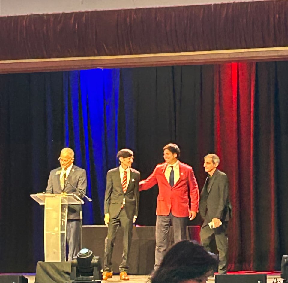 The three commissioners who voted for the sign, on stage at the Broward Republican Party's Reagan Day dinner, September 13, 2025, beneath the party's President Donald J. Trump sign slide